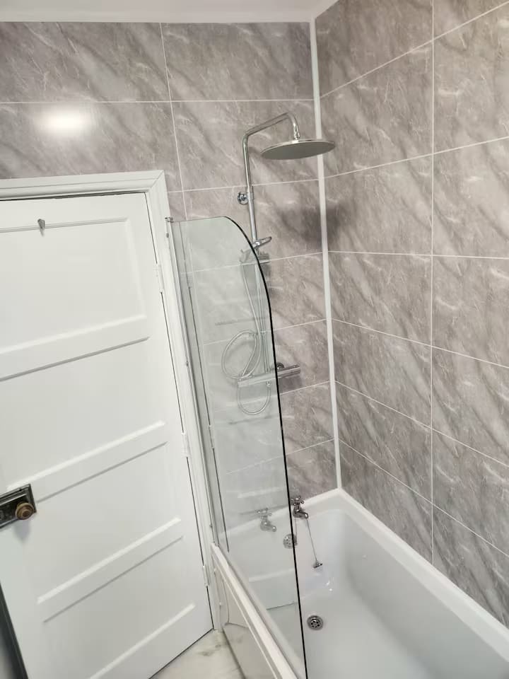 Bathroom with shower over the bath