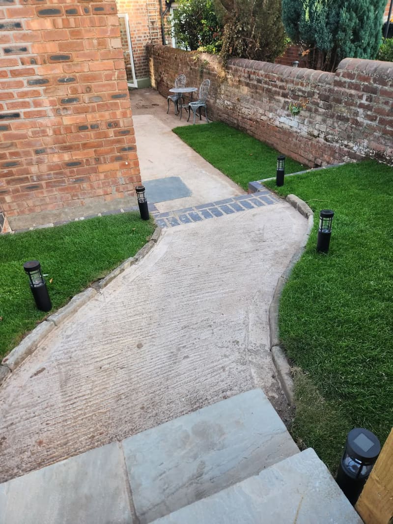 Garden path and lawn at the rear of the house
